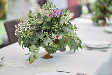 Composition of green dried flowers and wildflowers. Bouquet of green dried flowers and half flowers close up