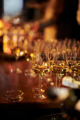 Glass goblets with alcoholic drinks. Evening leisure. Glasses with drinks in a restaurant