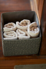 white towels in a gray box, close-up