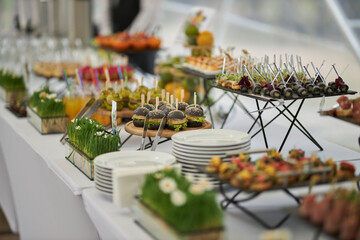 catering. Lots of snacks on stands. Tasty food.