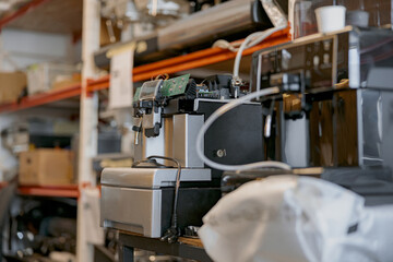 Warehouse with broken coffee machines ready to repair