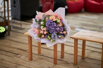 Bouquet of beautiful fresh flowers. Delicate bouquet. The bouquet is on a chair.