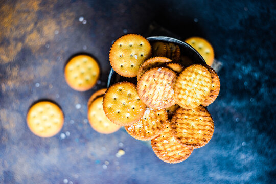 Overhead view of Salted cracker cookies in a metal bucket on a table