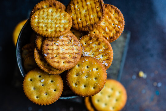 Overhead view of Salted cracker cookies in a metal bucket on a table
