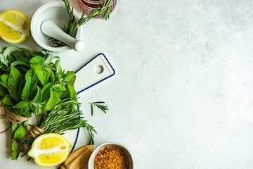 Overhead view of ingredients for making fresh lemonade on a table