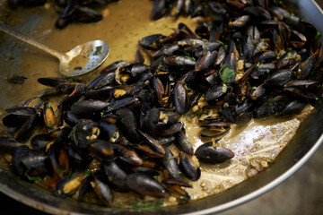 Mussels preparation. Mussels in sauce. shellfish