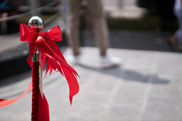 Red bow with red ribbon. Grand opening of the store. 