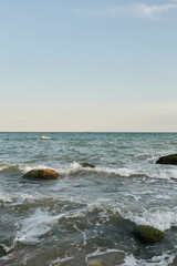 Fototapeta na wymiar Sea. The water's edge on the sea. Small waves on the sea. 