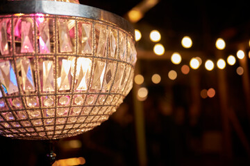 old vintage crystal chandelier close up, on a blurred background