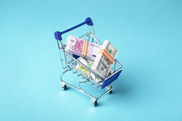 Shopping cart full of money, Dollars and Euro, sales and shopping, exchange concept
