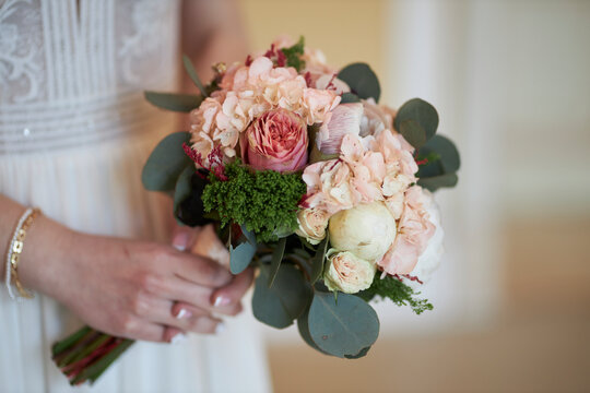 A beautiful wedding bouquet in the hands of the bride. The bride is holding a bouquet. bouquet close up