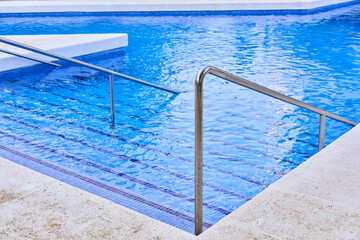 swimming pool with handrail and stairs