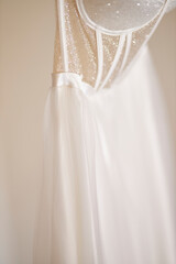 Wedding dress hanging on a trempel beautiful wedding dress 