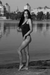 Beautiful woman in bikini at the river in black and white