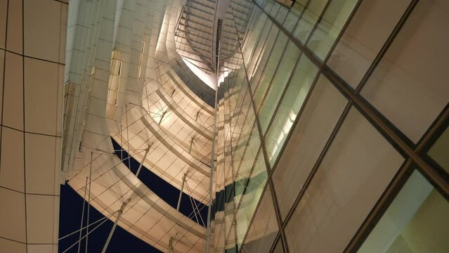 night time illuminated singapore city library building front up view panorama 4k 