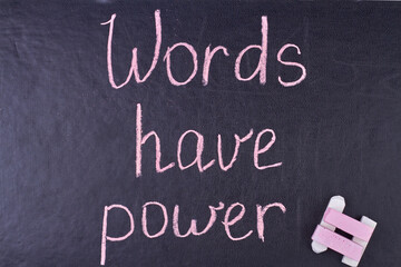 Words have power inscription written with chalk on black board. Inspiration and motivation concept.