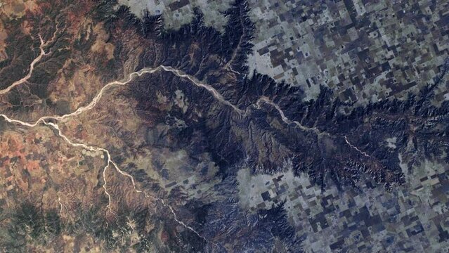 Grand Canyon aerial satellite view from sky of mountains and river sunrise animation. Based on image furnished by Nasa