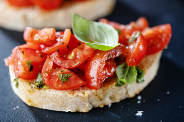 Tasty bruschetta with tomatoes and basil