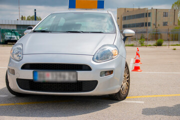 Fototapeta na wymiar Driving school or test. Training parking. How to drive and park car between cones.