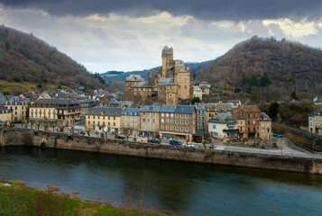 Aerial view of picturesque village of Estaing with medieval castle and gothique arched bridge...