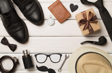 Father's Day accessories on wooden background, top view