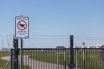 aviation, travel by airplane, warning sign "drones forbidden - no drone zone" at the fence of the airport Franz Josef Strauss Munich, Bavaria, Germany