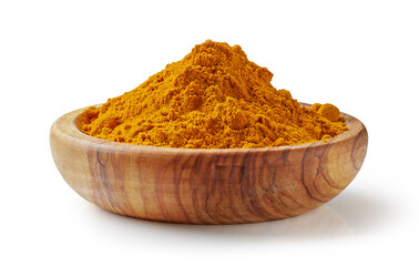 curry powder in olive wood bowl isolated on white background