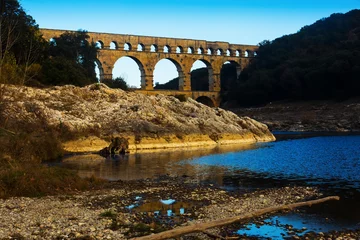 Photo sur Plexiglas Pont du Gard Picture of old Roman Bridge Pont du Gard in autumn in South of France