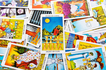 Tarot cards, Rider Waite tarot cards,the eight of cups card in the foreground.