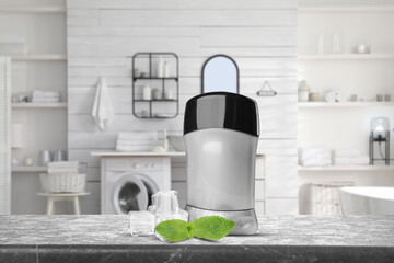 Solid deodorant, mint and ice cubes on grey table in bathroom. Mockup for design