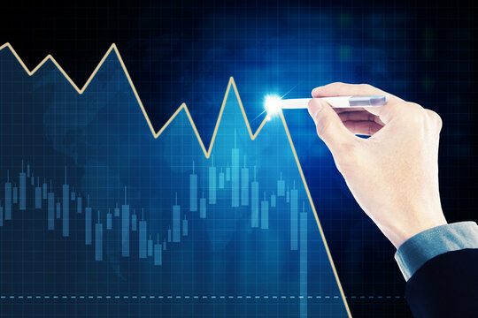 Young man hand drawing declining arrow