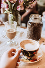 cup of coffee with a rose