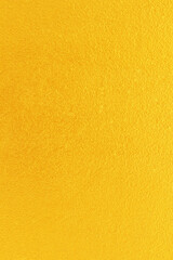 Fototapeta premium Gold or yellow paint on cement wall texture background.