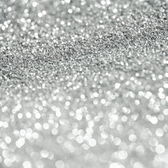 Silver glitter bokeh lights background .Defocused illumination for holidays backgrounds