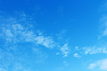 Fototapeta na wymiar Blank sky surface with small clouds