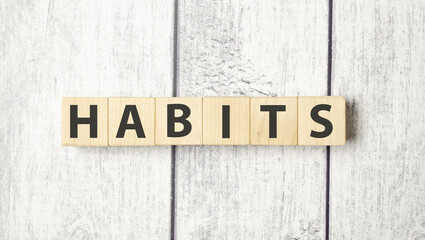 HABITS word written on wood block. HABITS text on cement table for your design, concept