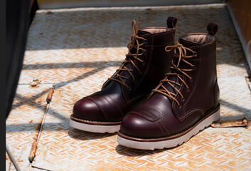 Man fashion brown boot leather on the floor.