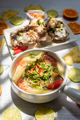 Vietnamese family food. Sour soup bowl of snakehead fish is rich in Vietnamese culinary identity