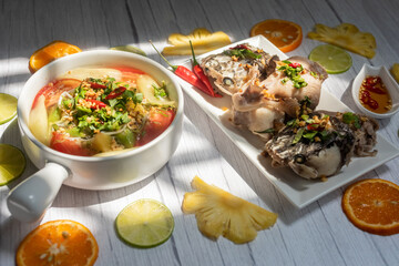 Vietnamese family food. Sour soup bowl of snakehead fish is rich in Vietnamese culinary identity