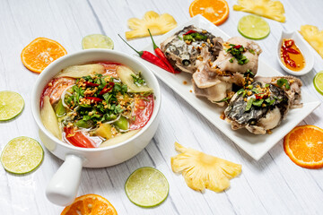 Vietnamese family food. Sour soup bowl of snakehead fish is rich in Vietnamese culinary identity
