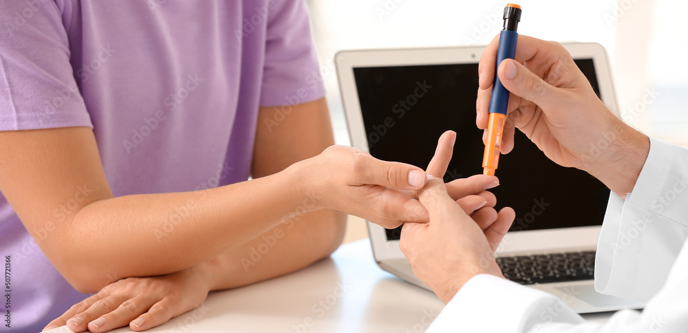 Poster Doctor checking blood sugar level of woman with diabetes in clinic