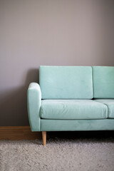 simple light grey sofa couch at home, minimalistic apartment style