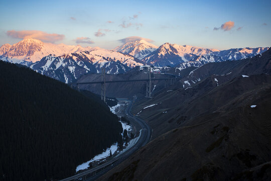 Xinjiang fruit valley and snow mountains with colorful sunset or sunrise