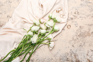 Obraz na płótnie Canvas Beautiful ranunculus flowers and accessories on light background