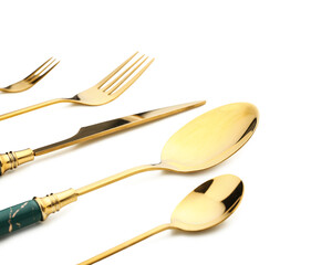Set of stainless steel cutlery on white background, closeup