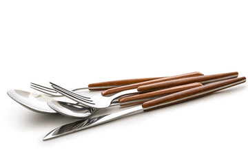 Set of stainless steel cutlery with wooden handle on white background