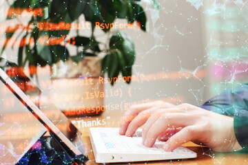 Businessman working with laptop computer on wooden desk in modern office . Programmers and cyber...