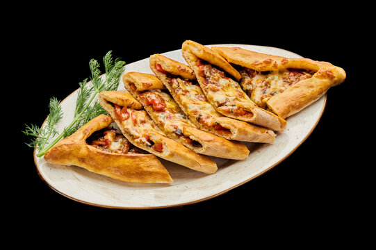 turkish vegetarian pizza pide on a black isolated background