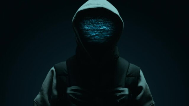 Computer hacker with hoodie and glitch face. Computer abstract digital code. Darknet fraud and cryptocurrency bitcoin concept. Cybersecurity and data protection in social network