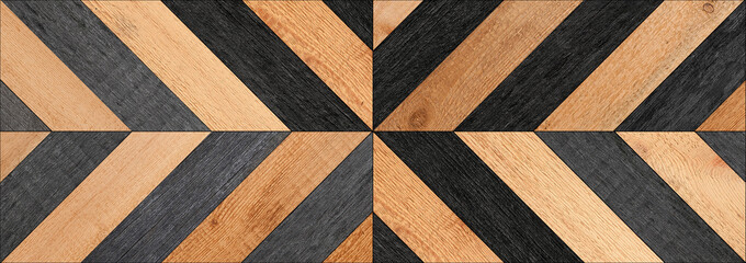 Vintage parquet floor. Black and brown wooden wall with herringbone pattern. Wood texture for background.